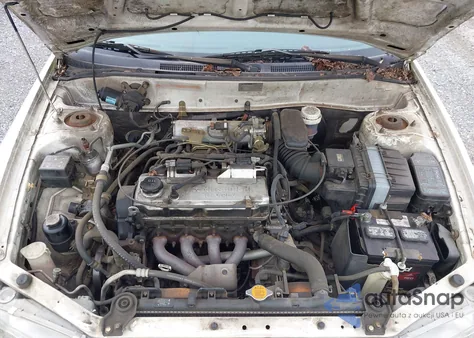 2001 Mitsubishi Mirage Es z USA, uszkodzony, nr VIN JA3AY26C11U038582